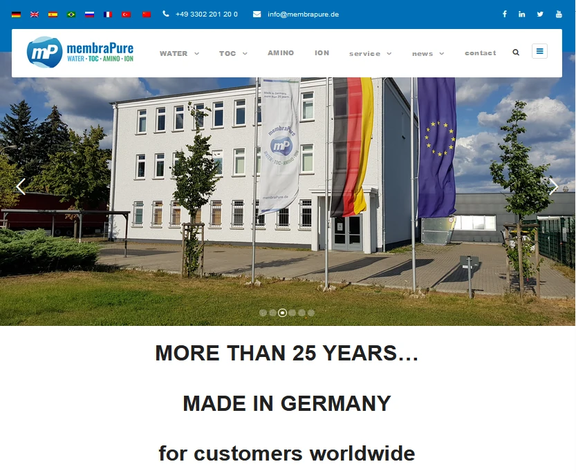 The image features the membraPure GmbH building, showcasing a modern structure with flags