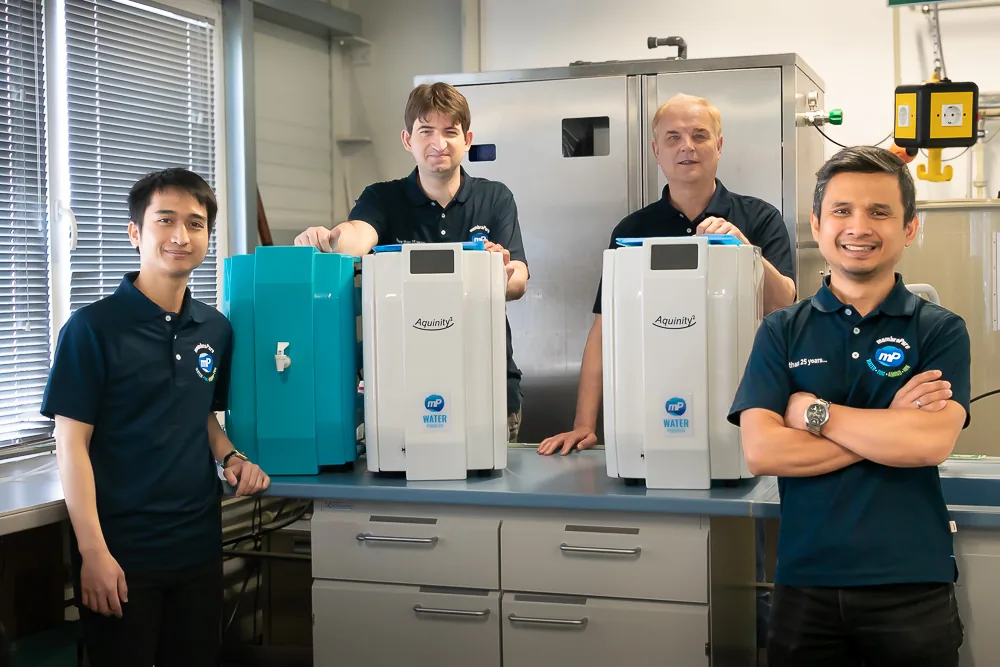 membraPure team with laboratory equipment in a lab setting.